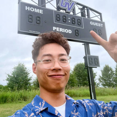 Hoan Lam Standing in front of the score board he programmed